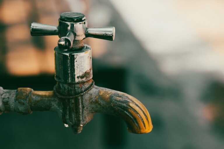 Hard water build up on old faucet
